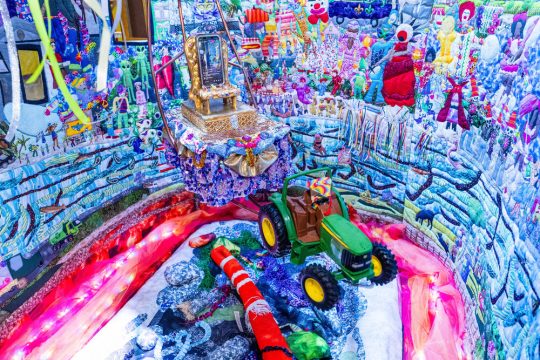 Quilted Mardi Gras-themed exhibit scene at JAMNOLA